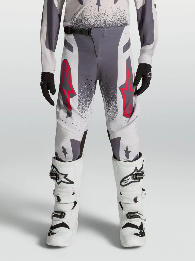 Alpinestars Youth Supertech Swan Pants, performance motocross racing gear in gray and lilac textile with red accents.