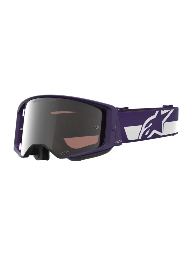 Alpinestars Limited Edition HUNTA96 XXV Supertech Vision Goggles, Motocross Goggles, Purple and White with Silver Mirror Lens, featuring "ONE GOAL. ONE VISION." text on the lens, wide adjustable strap with prominent Alpinestars logo, high-performance protective eyewear for off-road racing