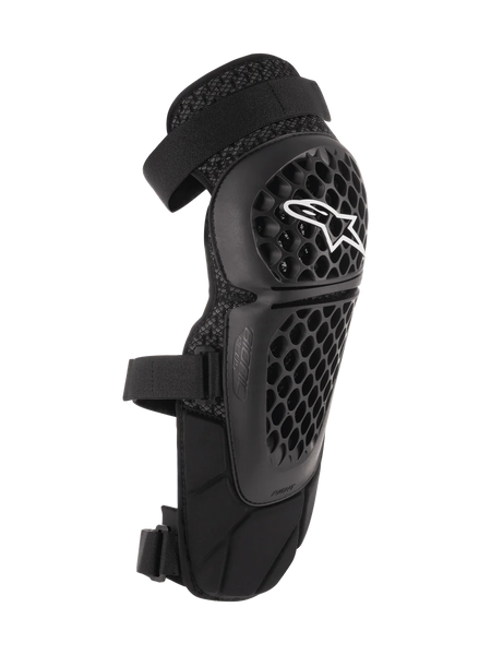 Alpinestars Bionic Plus Knee/Shin Protectors, Black, Off-road and MTB Protection, featuring a perforated honeycomb shell with a white Alpinestars logo, dual adjustable straps, and 3D mesh ventilation, ergonomic curved design