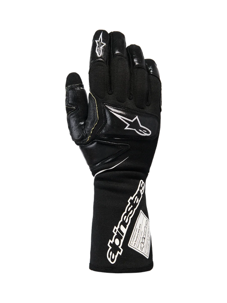 Alpinestars Tech-M V2 Gloves FIA, Black and White Pit-Crew Racing Gloves, featuring an extended cuff with bold Alpinestars branding and FIA certification tag, reinforced knuckle and finger patches for impact protection, professional motorsport gear