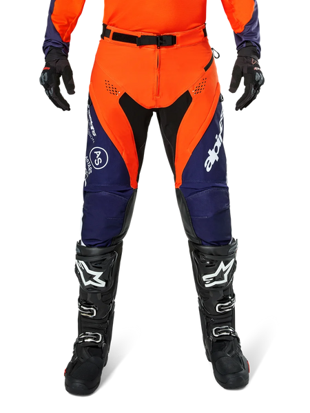 Alpinestars Pro-Dura Pants, Motocross and Enduro Pants, Navy Hot Orange and White, featuring black panels and white logos, worn with black off-road boots and gloves, professional protective gear for trail and off-road riding