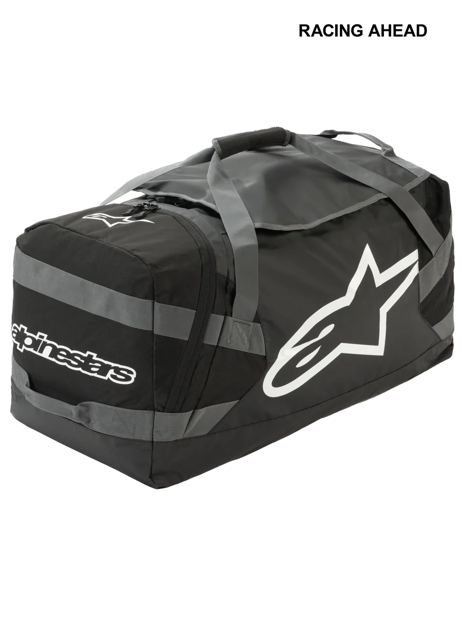 Alpinestars Goanna Bag, Motocross Duffle Bag, Black and Anthracite Gray with White logos, features large side star logo and wordmark, durable tarpaulin base, reinforced carry straps, large gear storage for off-road racing