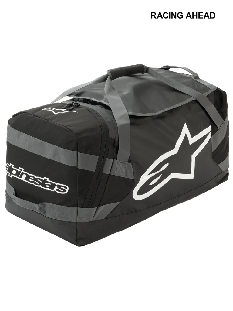 Alpinestars Goanna Bag, Motocross Duffle Bag, Black and Anthracite Gray with White logos, features large side star logo and wordmark, durable tarpaulin base, reinforced carry straps, large gear storage for off-road racing