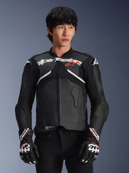 Alpinestars Atem V5 Leather Jacket, Motorcycle Racing Jacket, Black with White and Red Accents, premium leather construction with armored protection, worn with matching racing gloves