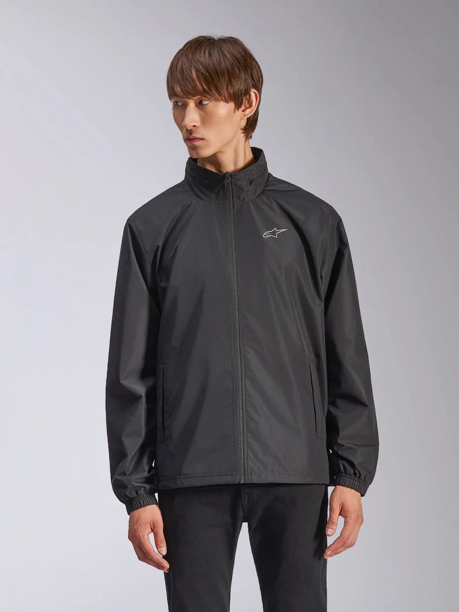 Alpinestars Overhaul Racer Jacket, Men's Black Rain Shell Jacket, featuring a high collar and full-length front zipper, small white logo on chest, elasticated cuffs, smooth water-resistant fabric, minimalist motorsport-inspired design