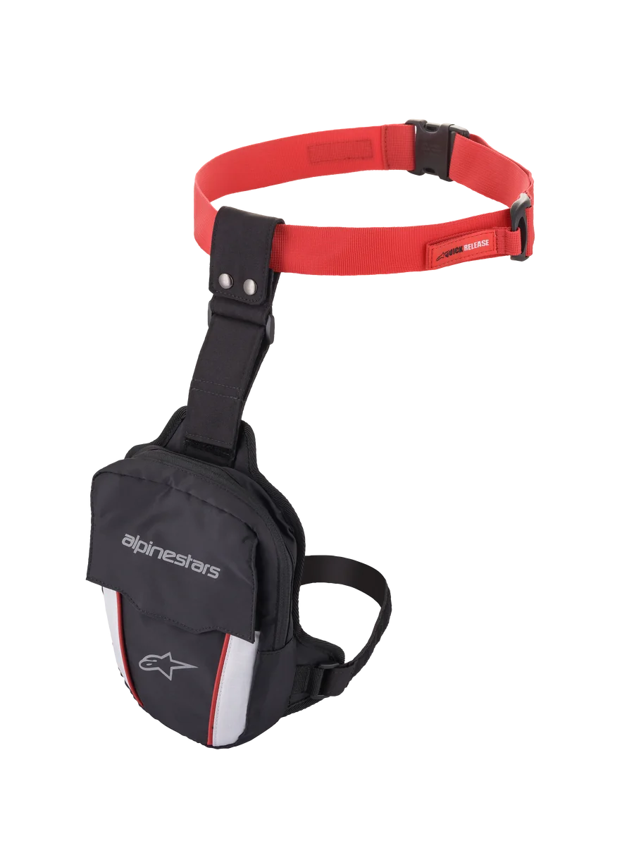 Alpinestars Access Thigh Bag, Motorcycle Thigh Bag, Black Red and White, featuring a red adjustable waist strap with quick-release buckle, black thigh strap, Alpinestars branding on the front flap, and reflective white panels with red accents for visibility.