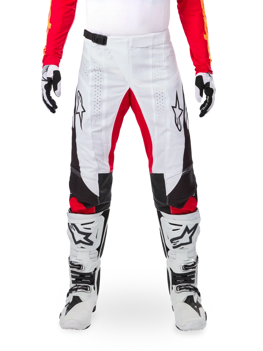 Alpinestars Limited Edition Techstar Deep Pants, Motocross Pants, Black White and High Red, worn with matching red jersey, white and black gloves and boots, featuring white front panels, red inner leg accents, black side panels, Alpinestars logos on thighs, and laser-perforated details for ventilation.