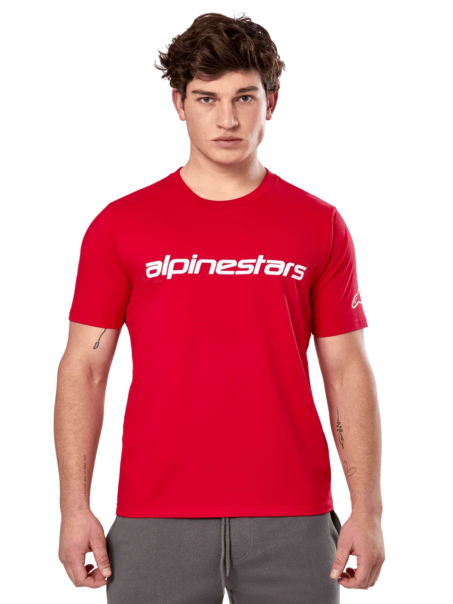 Alpinestars Linear Wordmark 2.0 CSF Tee, Short Sleeve T-Shirt, Red, White linear wordmark on chest and Ageless logo on sleeve, worn by male model with gray sweatpants, casual motorsport-inspired streetwear