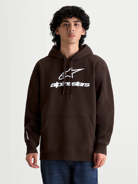 Alpinestars Prelude Oversized Hoodie on model, Men's Sportswear Fleece Pullover, Brown with White puff-print logo, oversized fit, kangaroo pocket, drawstring hood, cotton-rich blend.