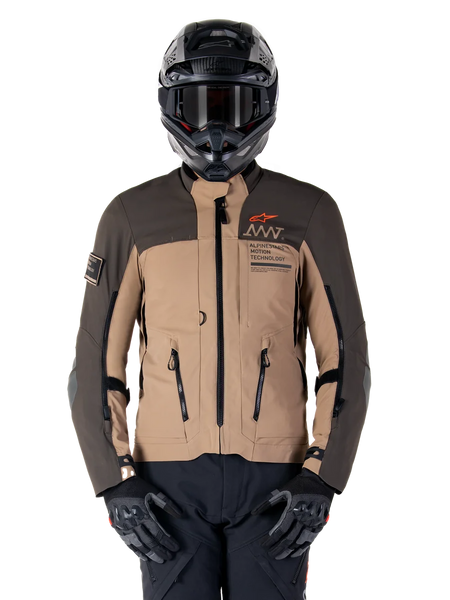 Alpinestars AMT-8 Stretch Drystar XF Jacket, Motorcycle Adventure Touring Jacket, Dark Khaki and Dark Brown, featuring orange Astars logo and black zippers, worn with black adventure helmet and gloves, full riding gear setup