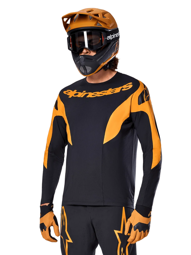 Alpinestars A-Supra Race Jersey - Long Sleeve, MTB Cycling Jersey, Black and Orange, worn with matching helmet and gloves, featuring Alpinestars branding on chest and stylized accents on sleeves, performance fit for off-road racing