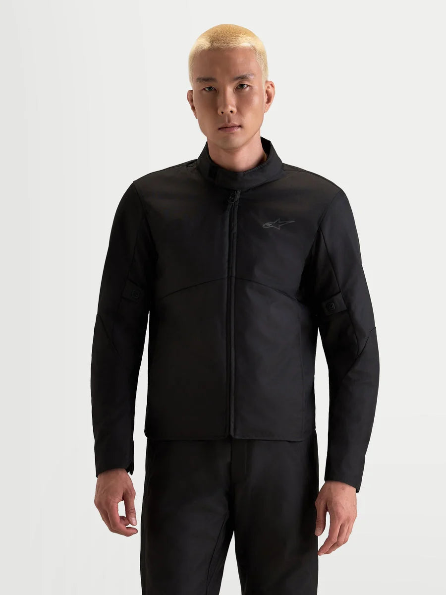 Alpinestars C-1 Waterproof Jacket, men's urban motorcycle jacket in black, front view worn by a model showcasing waterproof textile construction and high collar.