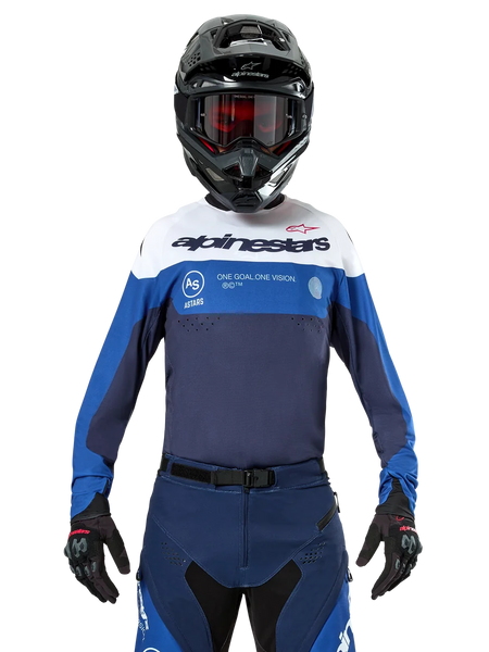 Alpinestars Pro-Dura Jersey, Motocross and Enduro Jersey, Navy, Bright Blue, and White, worn with matching navy pants, black gloves and helmet, featuring chest branding and laser-cut ventilation for off-road motorcycle racing