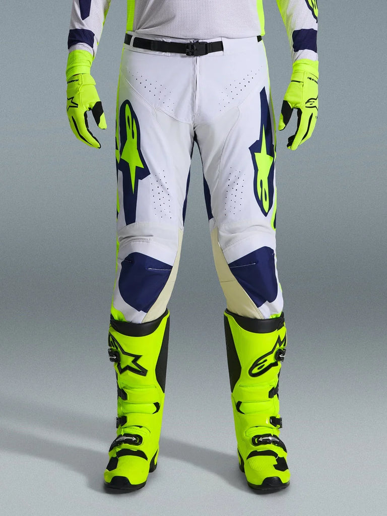 Alpinestars 2026 Racer Air Riway Pants, Motocross Pants, Light Gray Yellow Fluo and Blue, worn with matching neon yellow gloves and boots, featuring perforated front panels for airflow and bold blue and yellow branding, athletic design for off-road performance