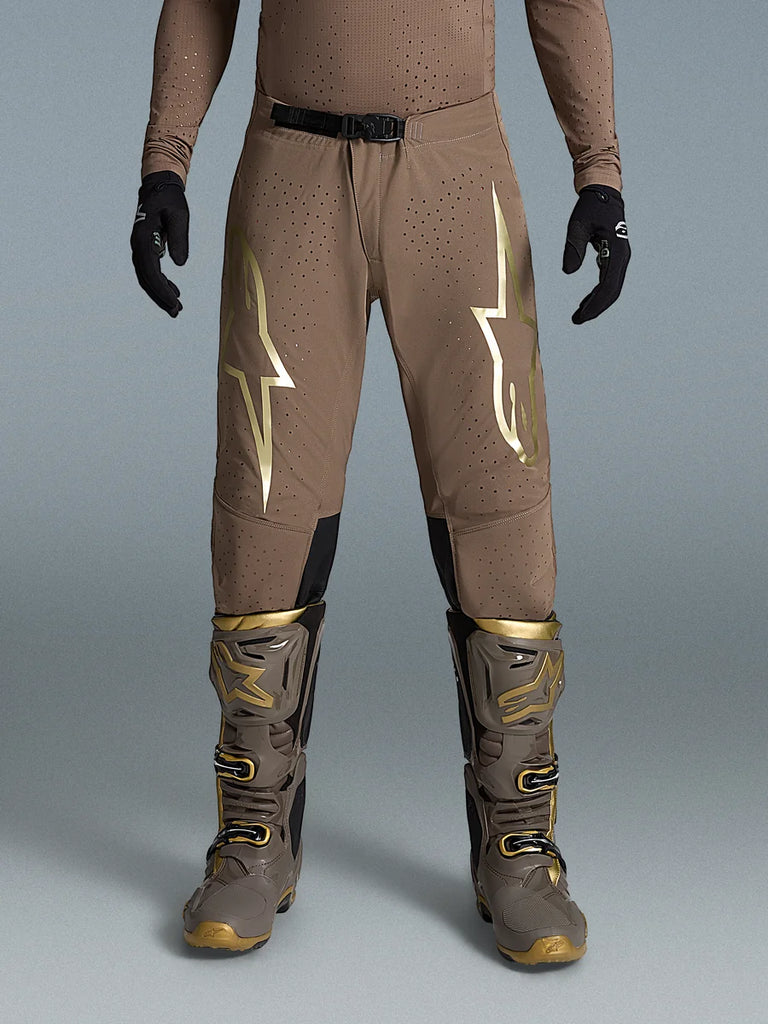 Alpinestars Limited Edition Supertech Air Gold Pants, Brown and Gold Motocross Gear on-model with Tech 10 boots.