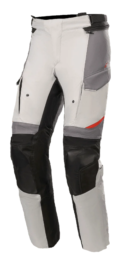 Alpinestars Andes V3 Drystar® Pants, Motorcycle Adventure Touring Pants, Ice Gray and Dark Gray with black accents, featuring reinforced knee panels, cargo-style pockets, and adjustable waist strap, durable textile material with red details