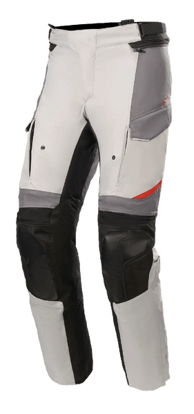 Alpinestars Andes V3 Drystar® Pants, Motorcycle Adventure Touring Pants, Ice Gray and Dark Gray with black accents, featuring reinforced knee panels, cargo-style pockets, and adjustable waist strap, durable textile material with red details