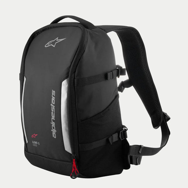 Alpinestars AMP3 Backpack, Black technical motorcycle bag with white logos, silver reflective panels, red zipper pulls, adjustable side compression straps, and padded mesh shoulder straps.