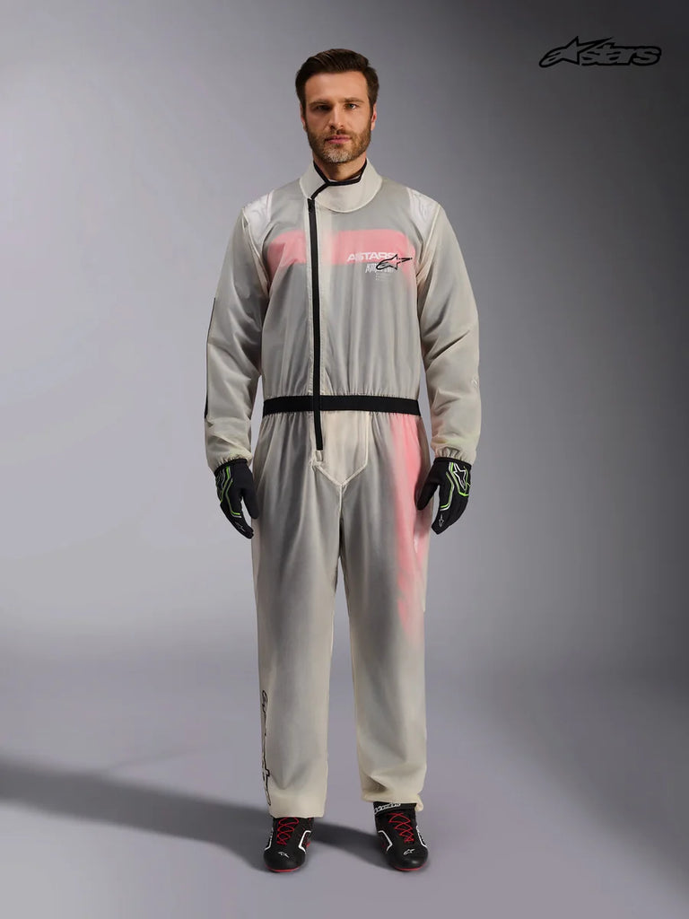 Alpinestars Kart Rain Suit, transparent waterproof karting oversuit for men in clear, front view on a model showing the asymmetric zipper and elasticized waist