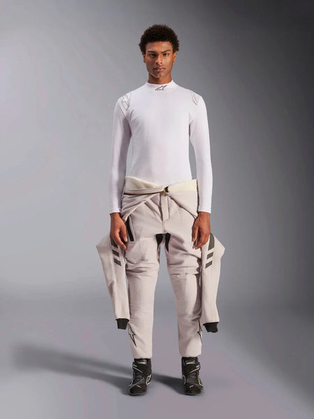 Alpinestars ZX Evo V3 Top, Long Sleeve, White, auto racing base layer worn with a light-colored racing suit tied around the waist and black racing boots, featuring a mock neck with logo and shoulder branding, professional flame-resistant motorsport underwear