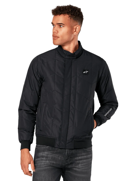 Alpinestars Precedent Jacket, Black Quilted Jacket with angled pattern, Formula 1 styling, low track collar, ribbed cuffs and hem, chest logo patch, sleeve embroidery, motorsport-inspired lifestyle streetwear