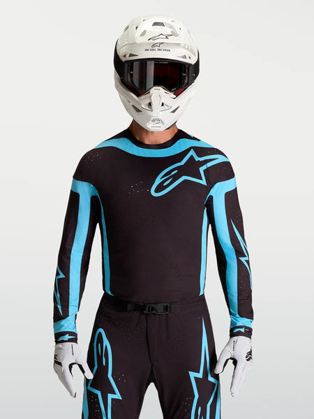 Alpinestars 2027 Supertech Vesta Jersey, men's black and turquoise motocross racing top with laser-cut stretch mesh panels.