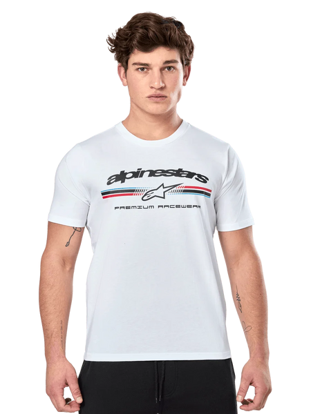Alpinestars Prevail CSF Tee, White Short Sleeve T-Shirt, featuring a front paddock-style tri-color stripe logo with red and blue accents, black Alpinestars branding, and 'Premium Racewear' text, worn by a male model, casual motorsport apparel
