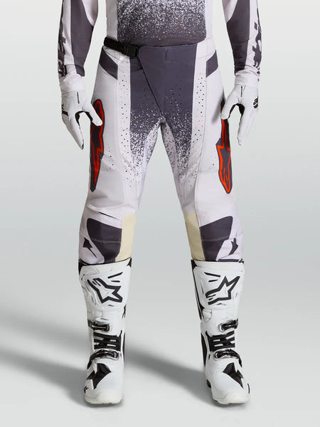 Alpinestars Techstar Swan Motocross Pants, Lilac and Dark Gray, featuring red accents and magnetic buckle.
