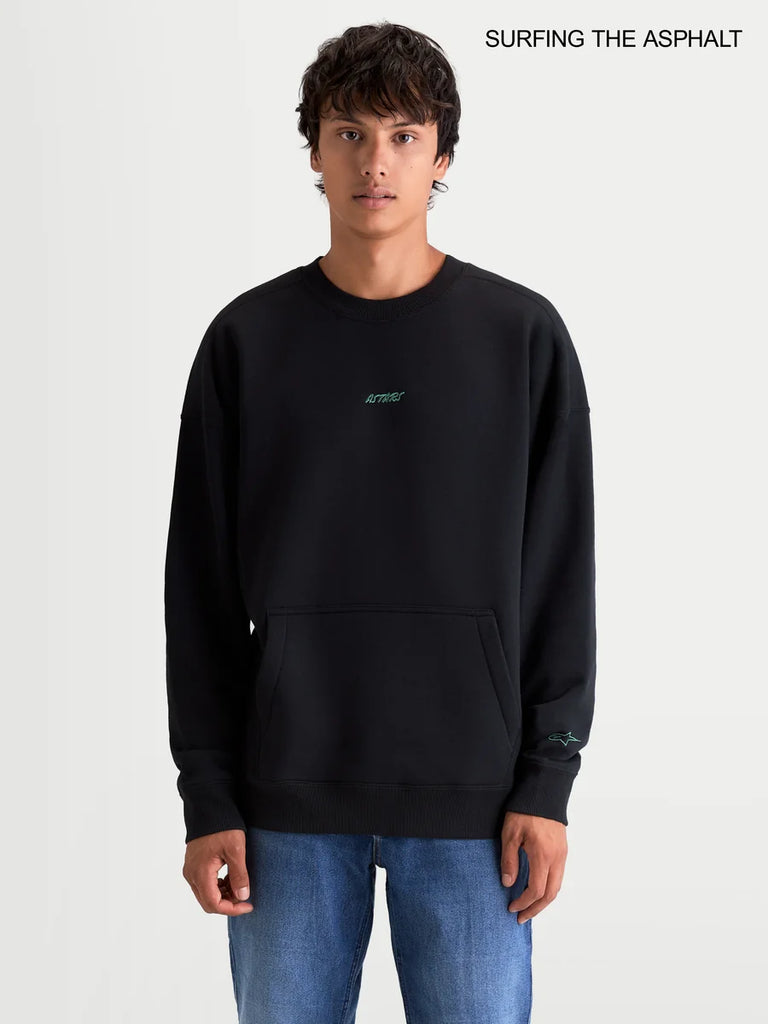 Alpinestars Guise Oversized Crew, men's sportswear fleece pullover in black, featuring a relaxed fit, crew neck, front kangaroo pocket, and embroidered logo worn by a model.