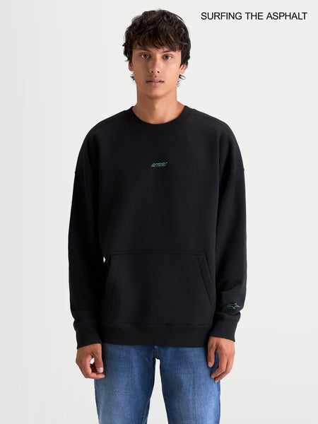 Alpinestars Guise Oversized Crew, men's sportswear fleece pullover in black, featuring a relaxed fit, crew neck, front kangaroo pocket, and embroidered logo worn by a model.