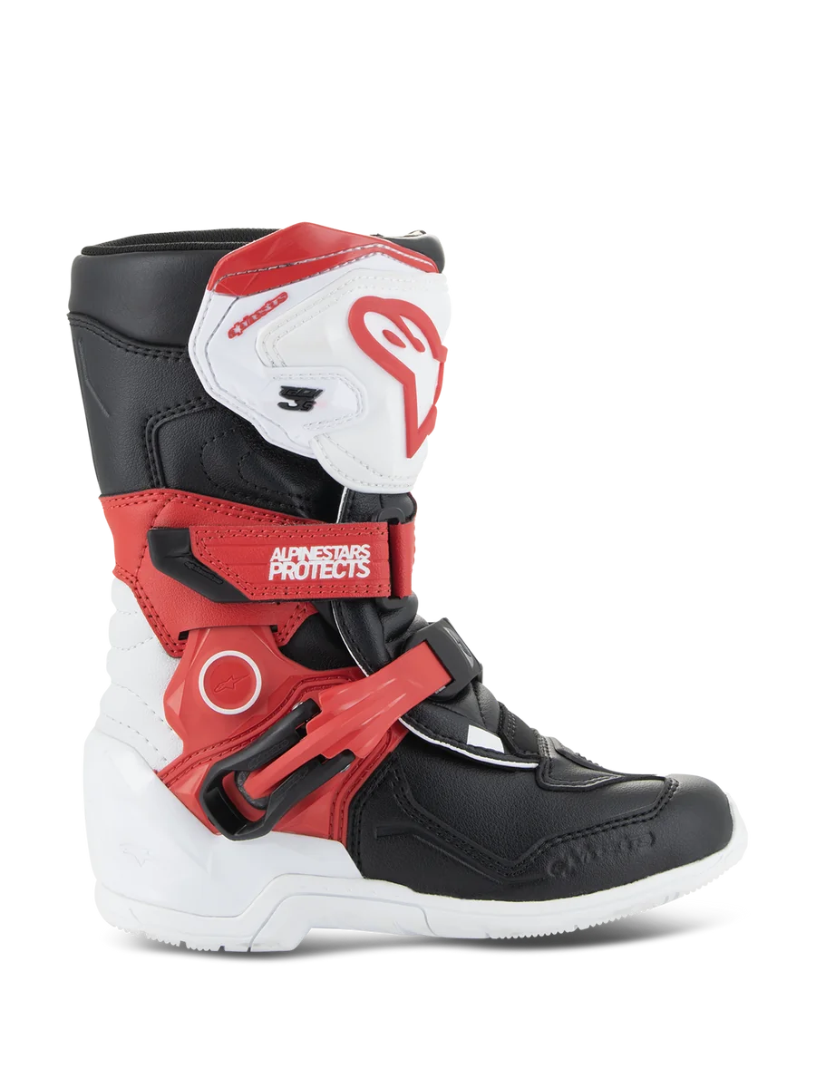 Alpinestars Kids Tech 3S Boots, Youth Motocross Boots, White Black and Bright Red, featuring a high-ankle protective design, adjustable red straps, white shin plate with red logo, and a durable white outsole.