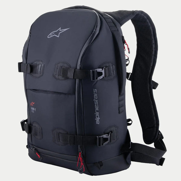 Alpinestars AMP-7 Backpack, technical motorcycle riding pack, Black with red zipper accents, featuring four adjustable compression straps with buckles, structured padded walls, Alpinestars logo on top and side branding, ergonomic shoulder straps for adventure and road touring.