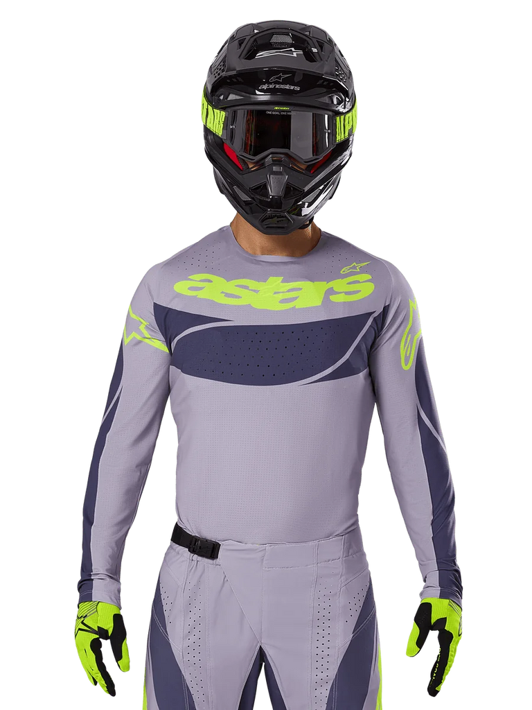 2025 Techstar Dreem Jersey and Gear Set, Motocross racing outfit, light gray and dark gray with neon yellow accents, features 'astars' branding, worn with black helmet, goggles, and matching gloves, technical perforated material for off-road performance
