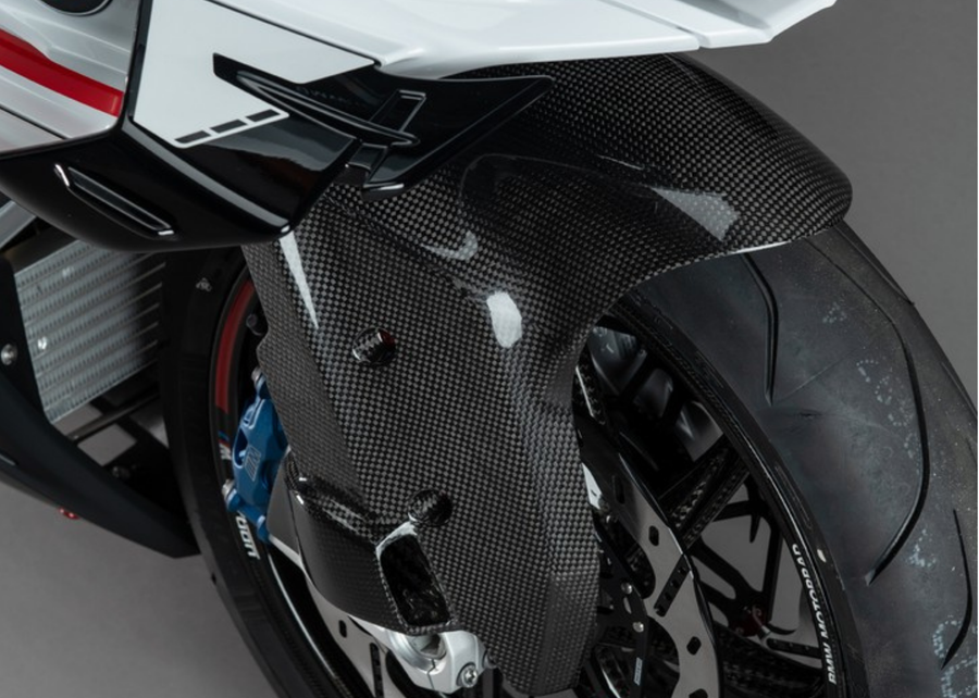 LighTech CARB1911 carbon front mudguard with brake-caliper cooling air intakes; installed view, motorcycle and brake components not included.