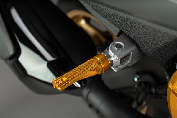 LighTech FTP100ORO single footpeg installed, gold side view; adapter, pin, original mounting bracket, motorcycle and other accessories are not included.