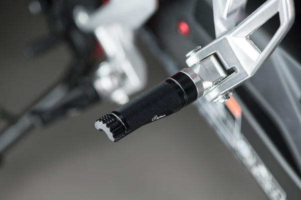LighTech FTP100NER single footpeg installed, black right-side view; adapter, pin, original mounting bracket, motorcycle and other accessories are not included.