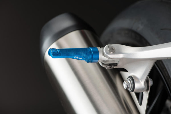 LighTech FTP100COB single footpeg installed, blue right-side view; adapter, pin, original mounting bracket, motorcycle and other accessories are not included.