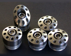 Titanium frame plugs