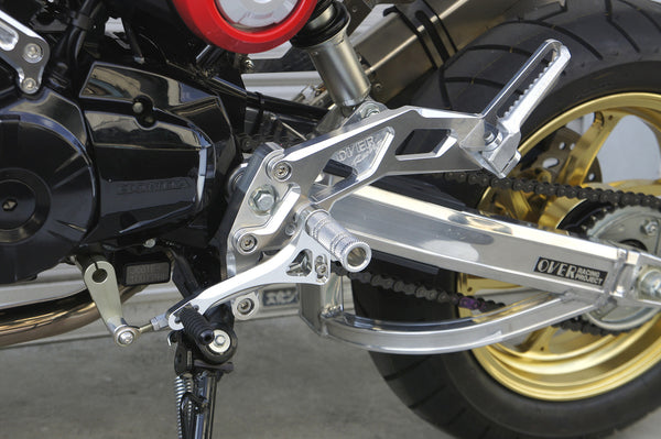 OVER Racing Rearset Kit 4-Position with Passenger Footpegs Black GROM (13-15) (16) (17-20) | 51-22-11B - image 1